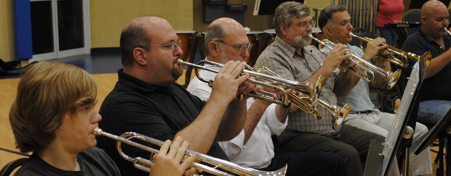 The trumpet section rehearses